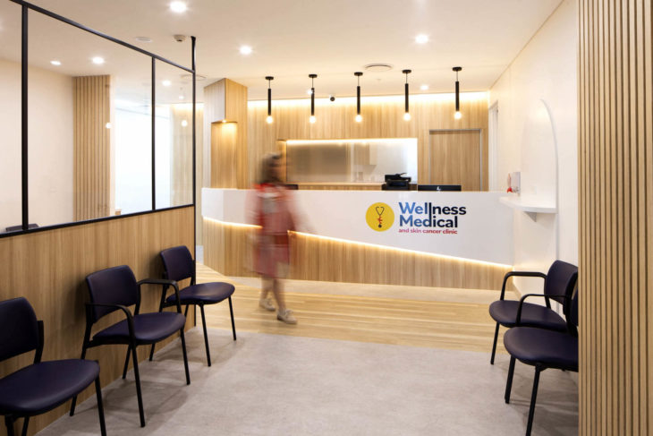 Contemporary Reception Design at Wellness Medical and Skin Cancer Clinic in Springfield Central, Queensland - Featuring Natural Stone, Oak Timber, and LED Lighting