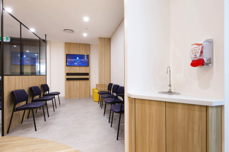 Modern Waiting Room Design at Wellness Medical and Skin Cancer Clinic in Springfield Central, Queensland - Comfortable Chairs, Stylish Display, Sanitiser, and Convenient Tap for a Relaxing Patient Experience
