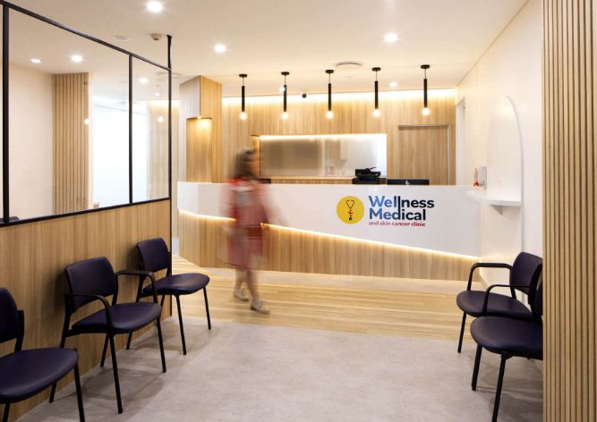 Contemporary Reception Design at Wellness Medical and Skin Cancer Clinic in Springfield Central, Queensland - Featuring Natural Stone, Oak Timber, and LED Lighting
