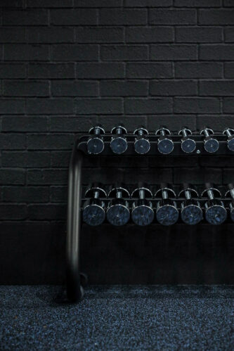 Technology One Brisbane - A fully equipped fitness facility with a rack of dumbbells, reflecting Technology One's commitment to employee fitness and wellbeing